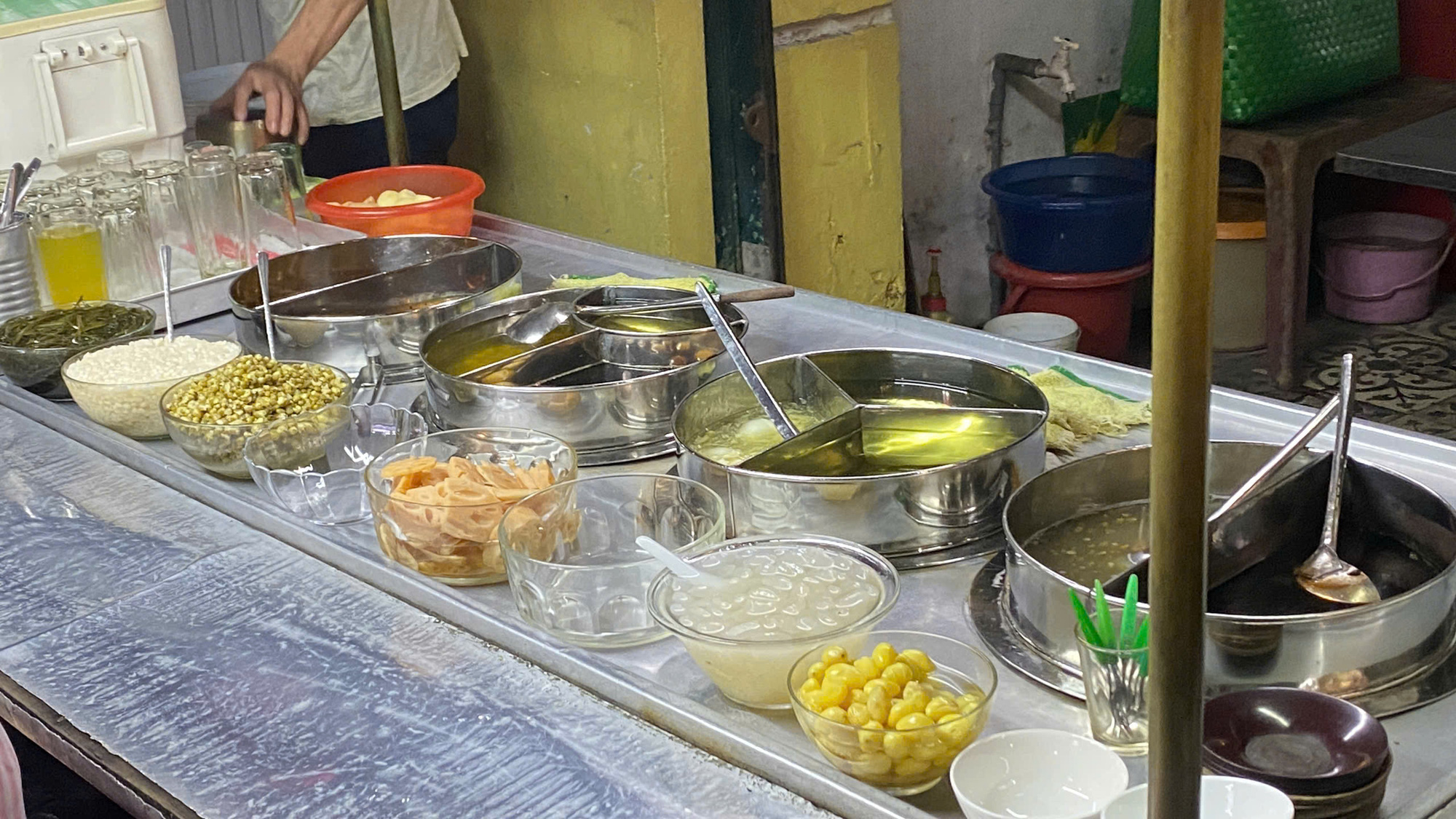 A delightful array of fresh ingredients neatly arranged in bowls and pots at the Lam Vinh Mau sweet soup shop on Nguyen Thai Binh Street in District 1, Ho Chi Minh City. Photo: Dang Khuong / Tuoi Tre