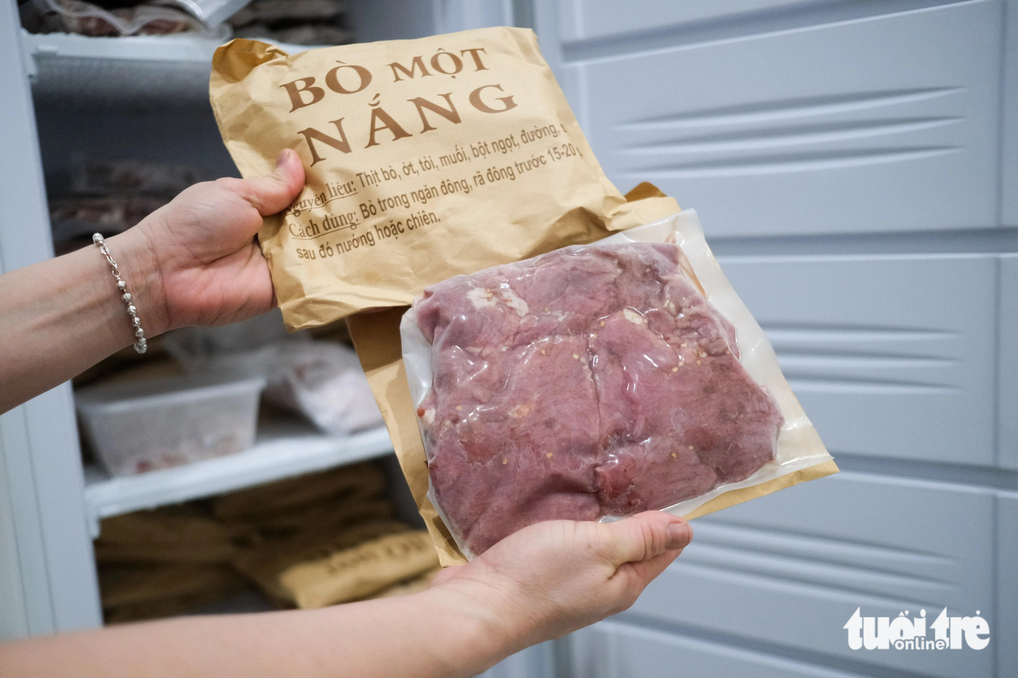 Sun-dried beef is vacuum-sealed and stored in the freezer before delivery to customers. Photo: Tan Luc / Tuoi Tre