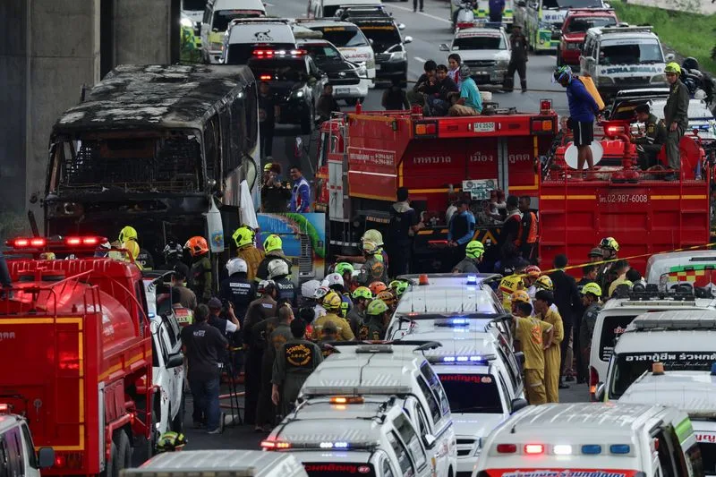 Rescue workers extinguish a burning bus carrying teachers and students from Wat Khao Phraya school, reportedly killing almost a dozen, on the outskirts of Bangkok, Thailand, October 1, 2024. Photo: Reuters