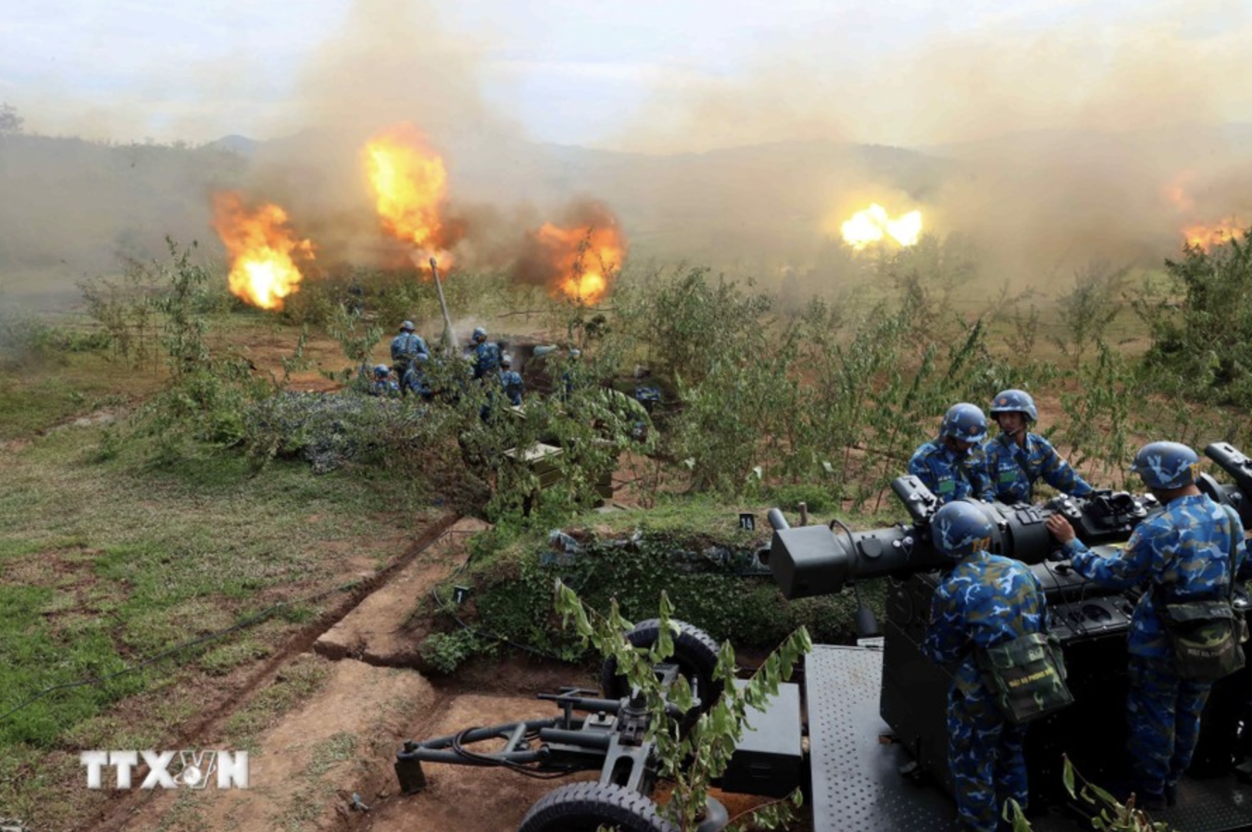 Soldiers fire rounds of 57 mm ammunition towards targets during the 2024 Hanoi defense drill. Photo: Vietnam News Agency