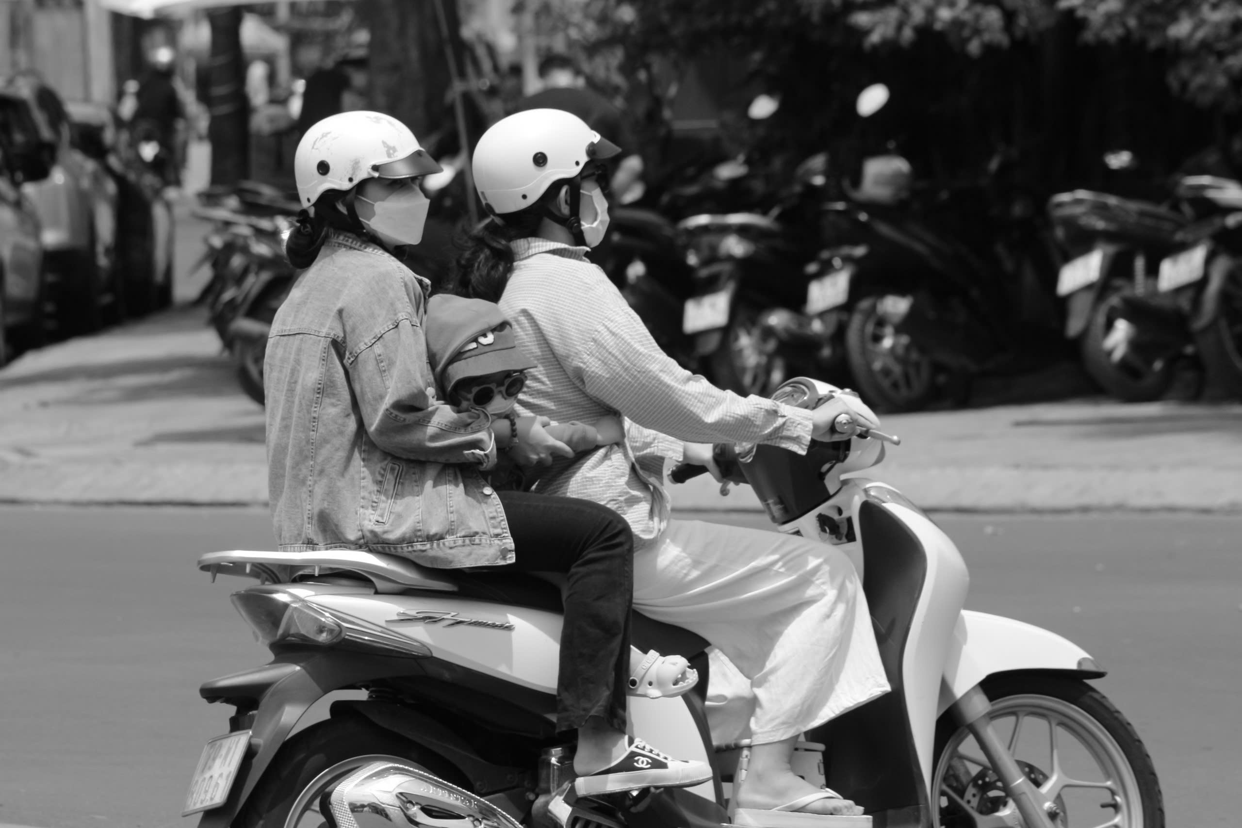 Why children under 6 are not wearing helmets on motorbikes in Vietnam