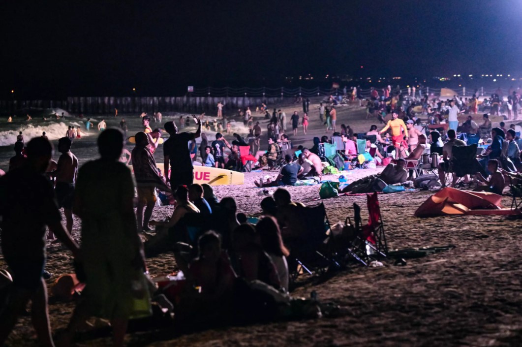 The beach's nocturnal facilities, which also include lifeguards equipped with night-vision binoculars, have proven popular with residents and tourists alike. Photo: AFP