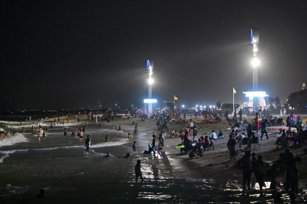 For the hundreds of thousands of migrant workers who keep Dubai's economy ticking, the beach is a welcome escape from the heat of the working day. Photo: AFP