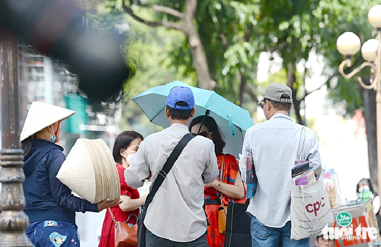 Peddlers cling to tourists in Ho Chi Minh City.