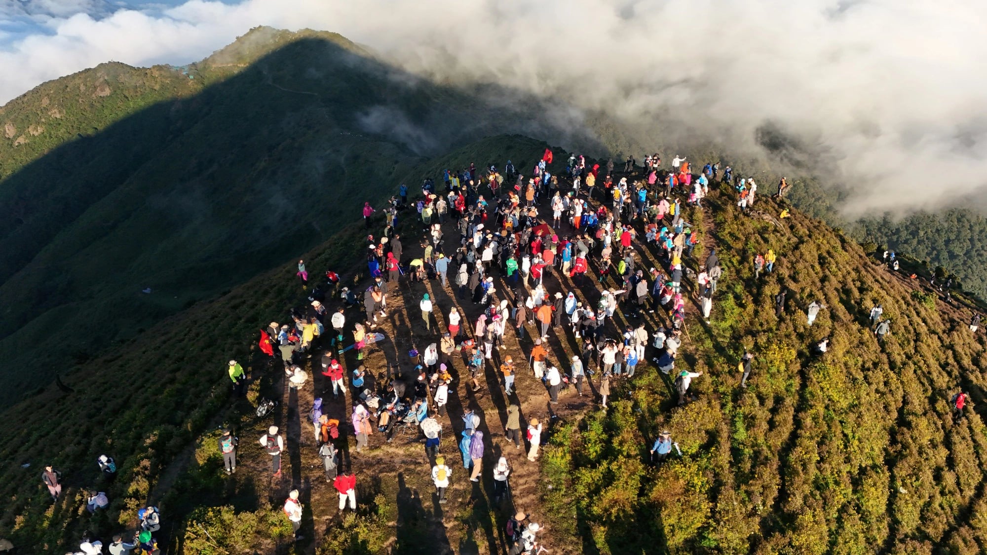 Vietnam’s 7th-highest peak draws cloud-hunting trekkers, wildflower enthusiasts