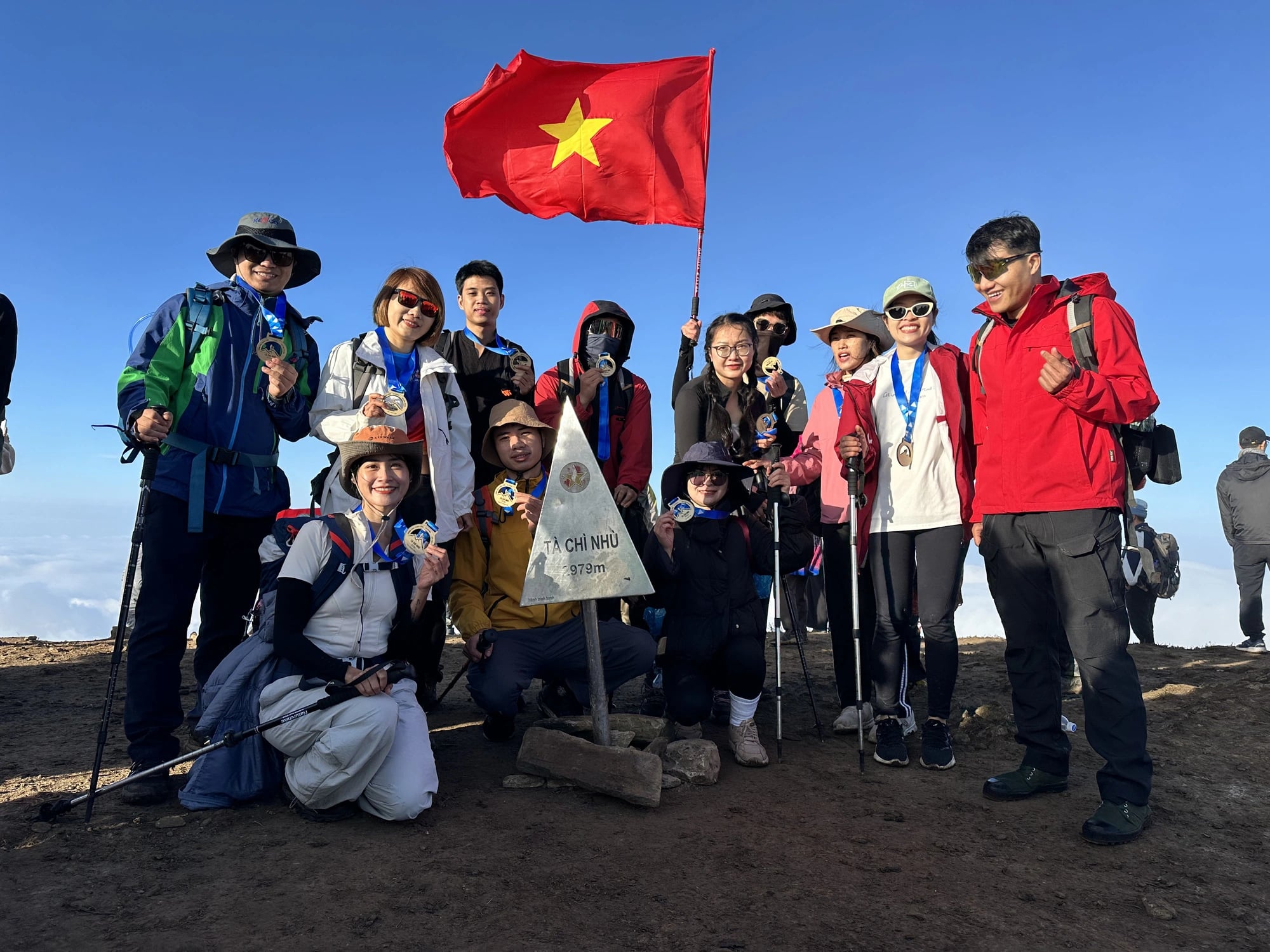 Trekkers pose for a photo at Ta Chi Nhu Peak in Tram Tau District, Yen Bai Province, northern Vietnam. Photo: Thua Hoa