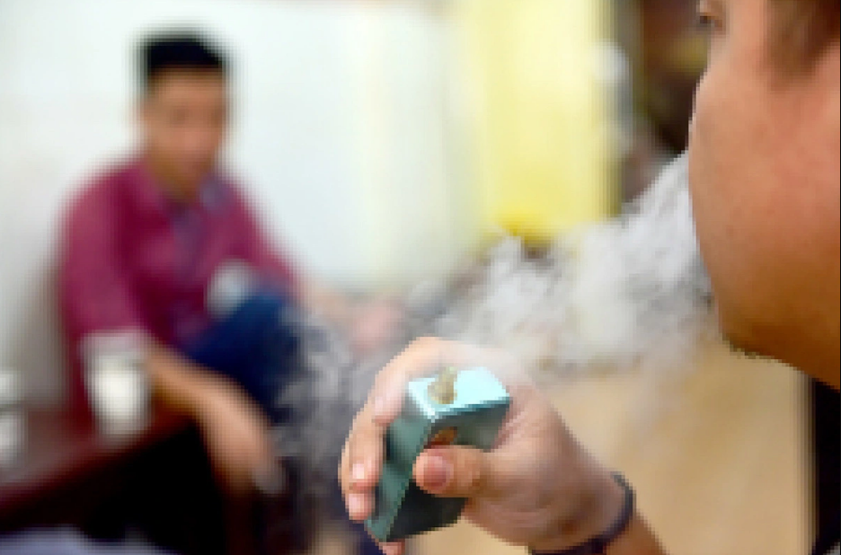 A young man is pictured vaping. Photo: Quang Dinh / Tuoi Tre