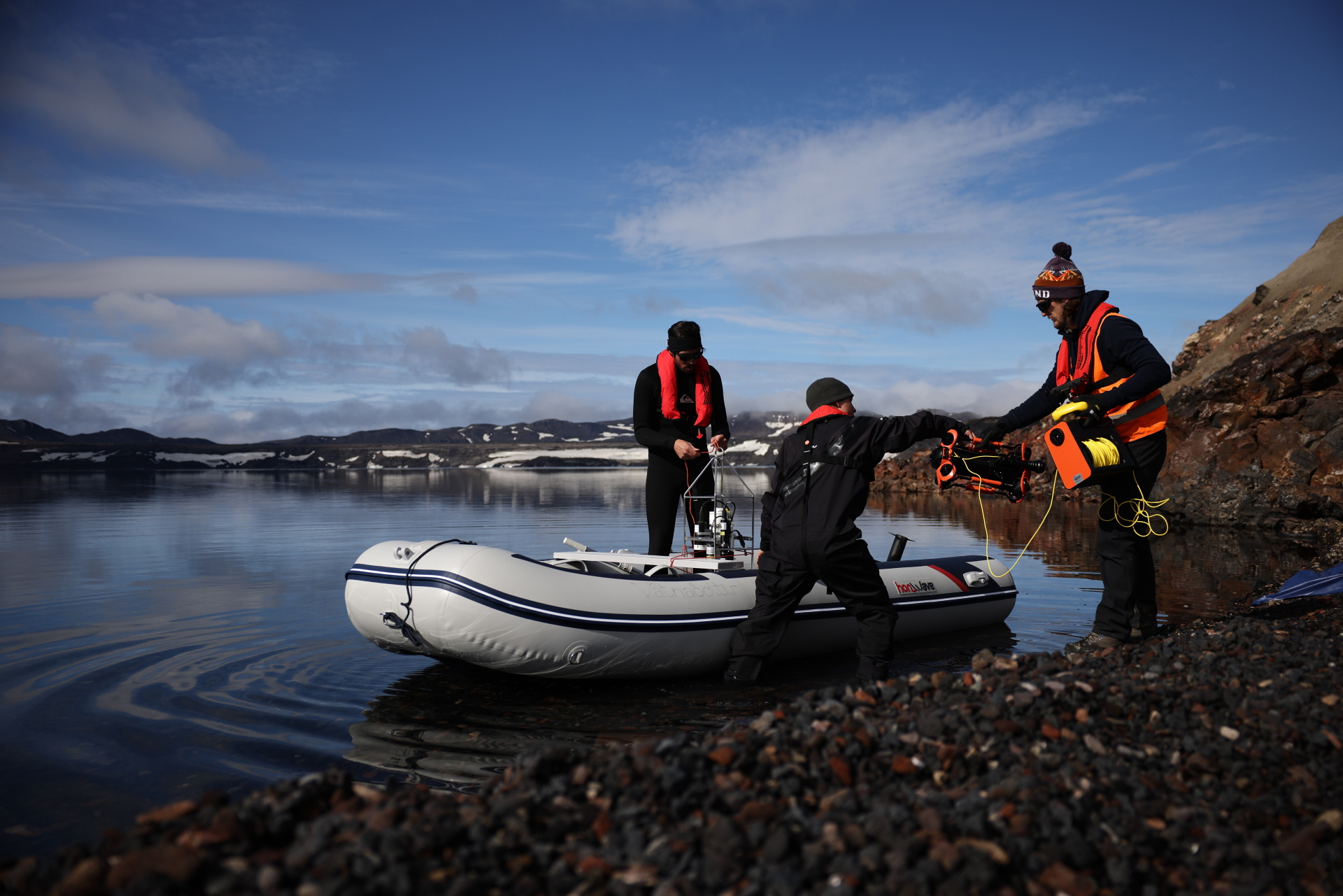 Scientists with the University of Geneva prepare to set out on a scientific mission on the dangerous waters of the Oskjuvatn caldera lake. Photo: Reuters