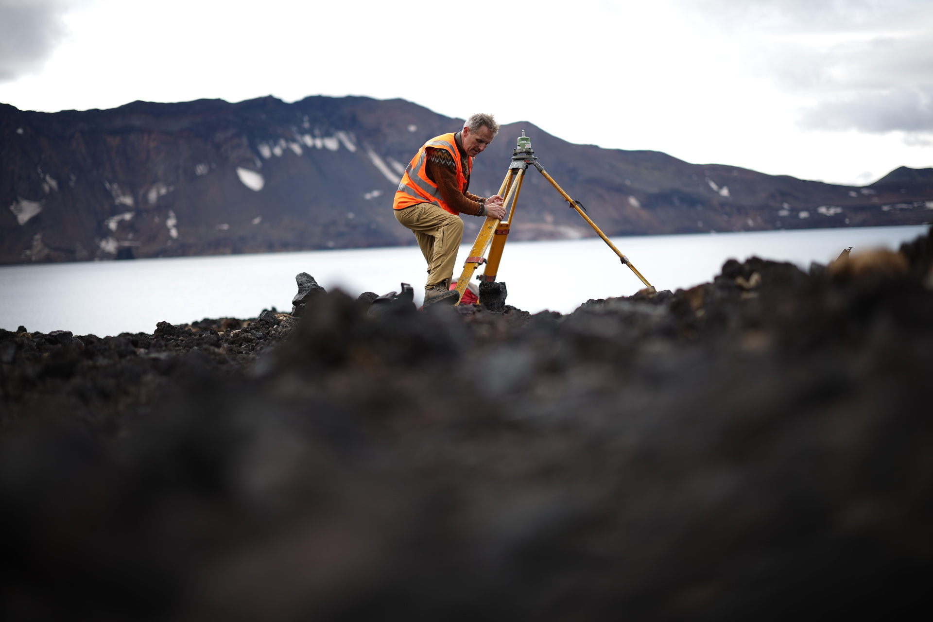 Freysteinn Sigmundsson, the University of Iceland geophysicist, uses a surveying tripod to track changes in Askja's position and ground uplift. Photo: Reuters