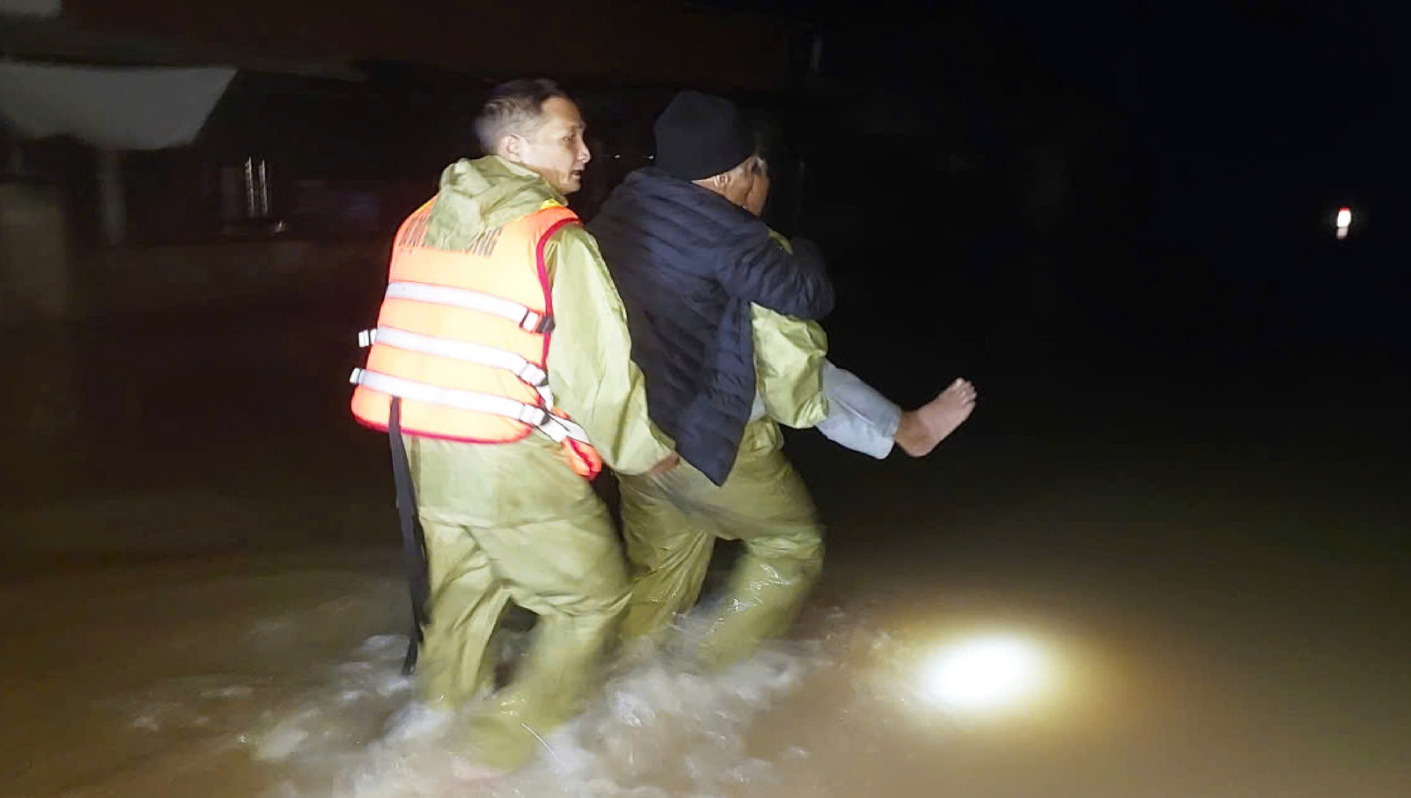 Central Vietnam border guards carry octogenarian patient 2km through floods for emergency treatment