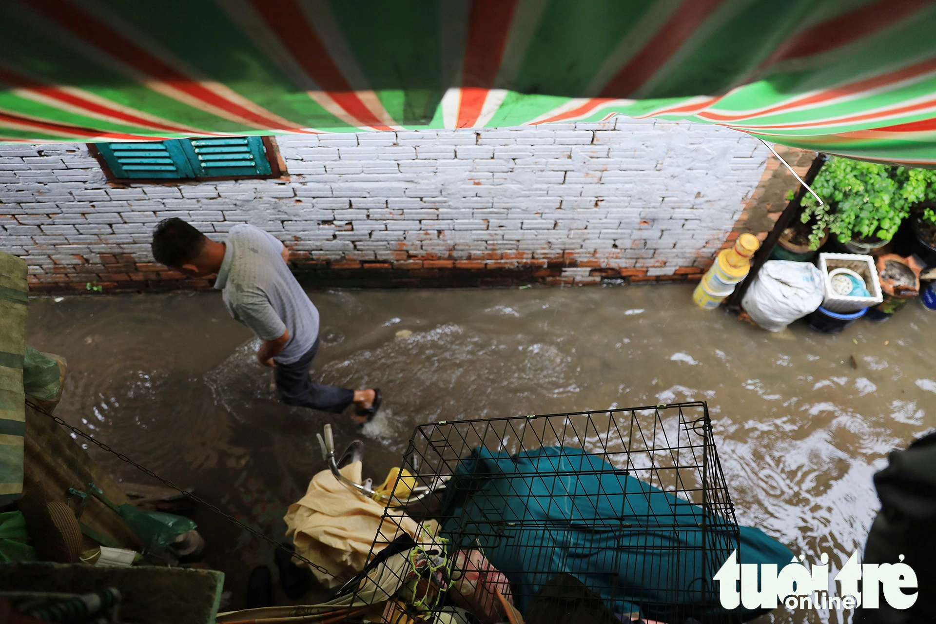 The narrow flooded entrance leading to Son’s house.