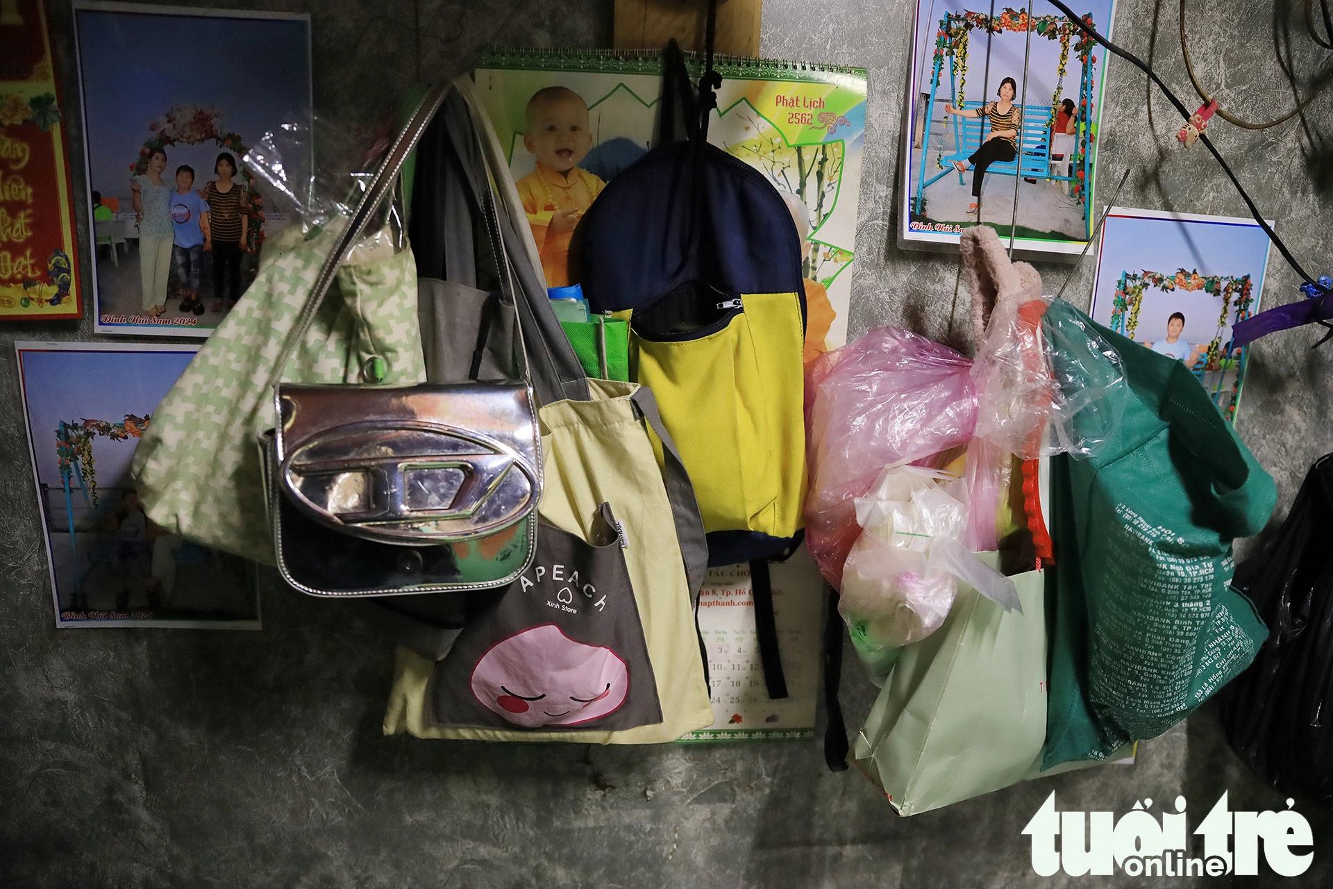 Thuy and her family are forced to hang their belongings along the walls so that they can have space to sleep at night.