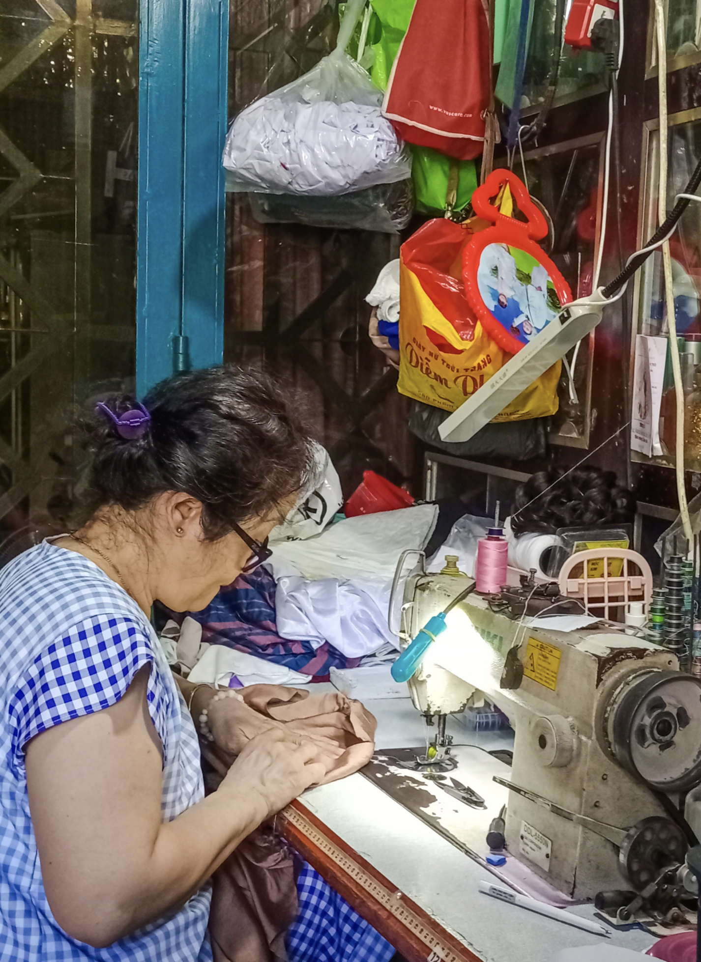 Ho Thi Thom, a 59-year-old local of the trackside village in Phu Nhuan District, has worked as a seamstress for 30 years. Photo: Pham Hong Yen Nhi