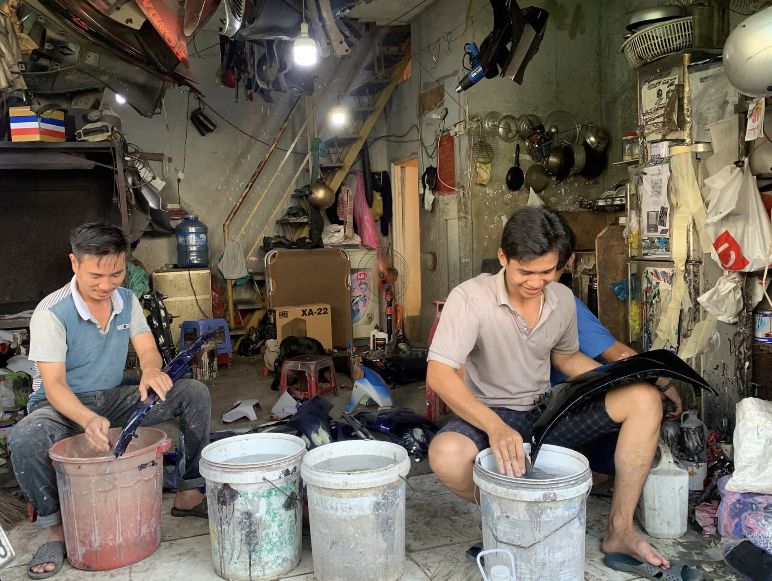 A motorcycle repair shop on Chien Thang Street in the trackside village in Phu Nhuan District, Ho Chi Minh City. Photo: Vo Tran Ngoc Tran