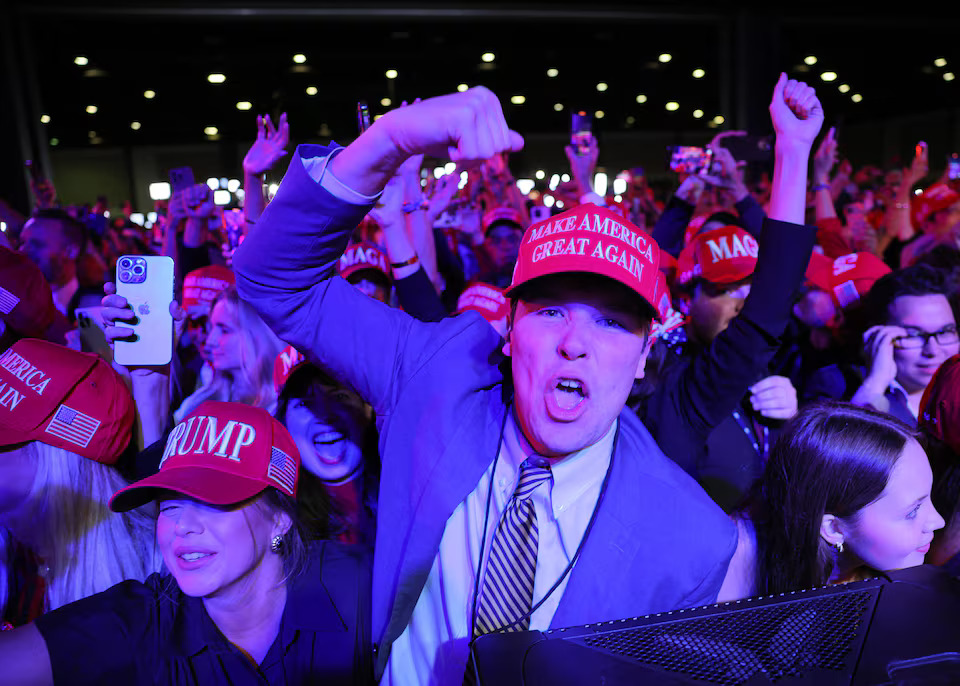 [4/6] Supporters of Donald Trump celebrate after the Fox Network called the election in his favor at his rally, at the Palm Beach County Convention Center in West Palm Beach, Florida. Photo: Reuters