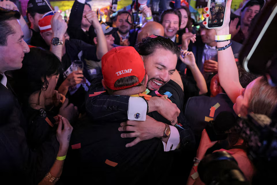 [2/6] Supporters of Donald Trump react to election results as they attend the New York Young Republican Club watch party in Manhattan, New York City. Photo: Reuters