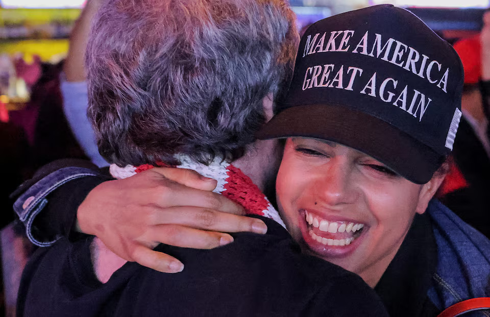 [5/6] A supporter of Donald Trump reacts to election results as she attends the New York Young Republican Club watch party in Manhattan, New York City. Photo: Reuters