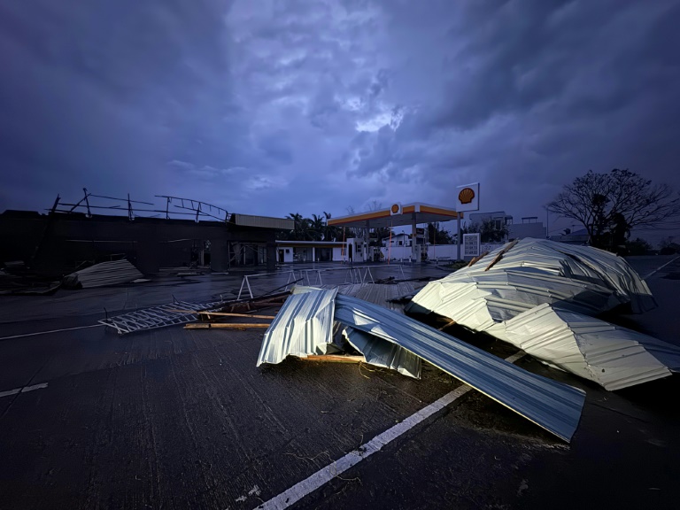 A roof of corrugated sheet litters after it was blown off along a highway in Cagayan province, the day after typhoon Yinxing hit the province. Photo: AFP