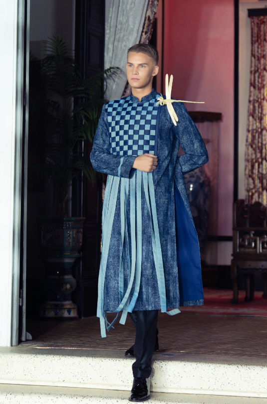 A contestant in ao dai struts down the runway at the Vietnam Beauty Fashion Fest 9, part of the 2024 Mr World held in Vung Tau City, Ba Ria - Vung Tau Province, southern Vietnam.