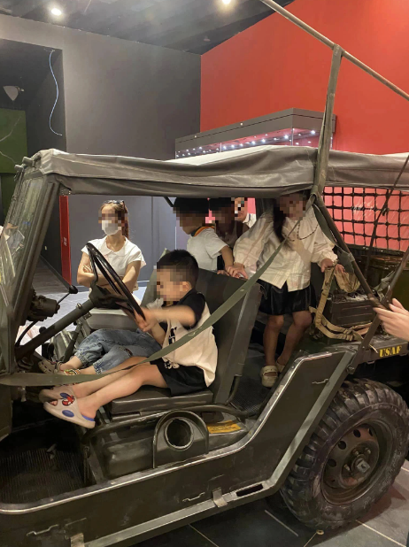 Children get onto a military vehicle in the Vietnam Military History Museum in Nam Tu Liem District, Hanoi. Photo: Trang Luong Minh