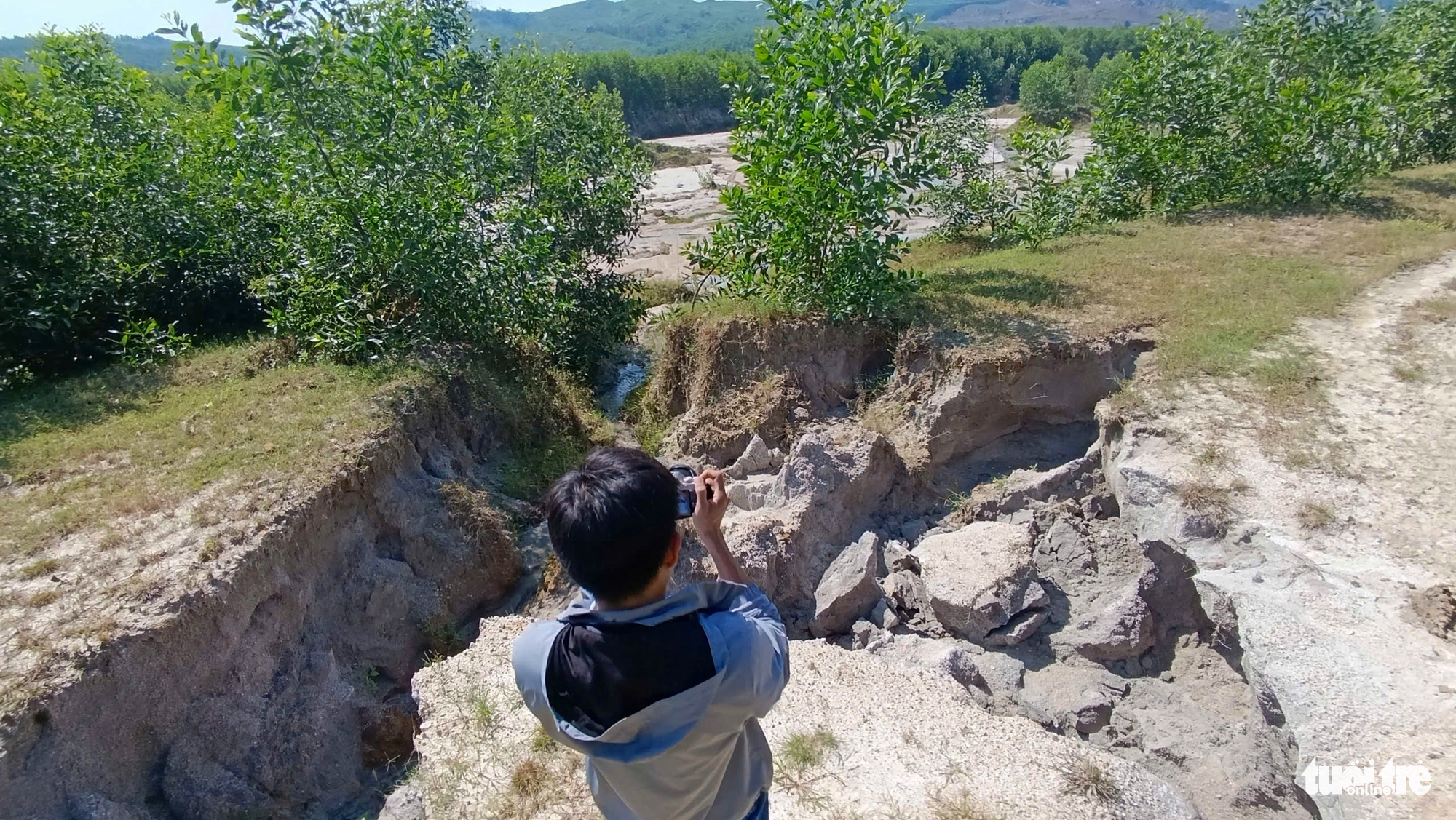 Large holes that resemble bomb craters in An Chau Village in Hoa Phu Commune, Hoa Vang District, Da Nang City, central Vietnam, following exploitation by a clay mining company. Photo: Doan Cuong / Tuoi Tre