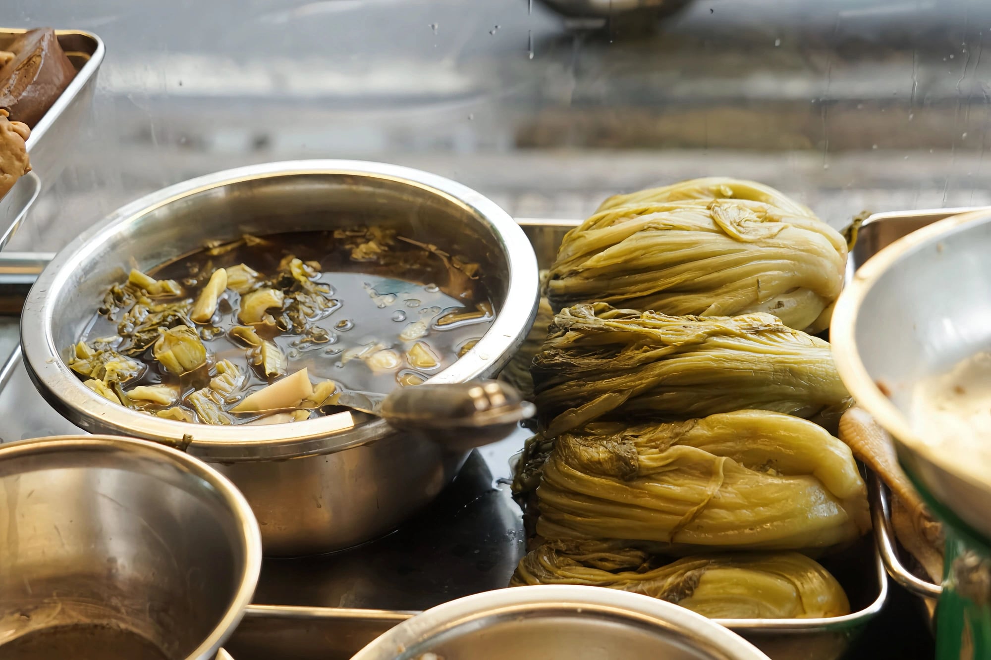 Pickled mustard greens are marinated in Chinese herbal broth at Phá Lấu Lâm Ký in District 11, Ho Chi Minh City. Photo: Le Duy / Tuoi Tre