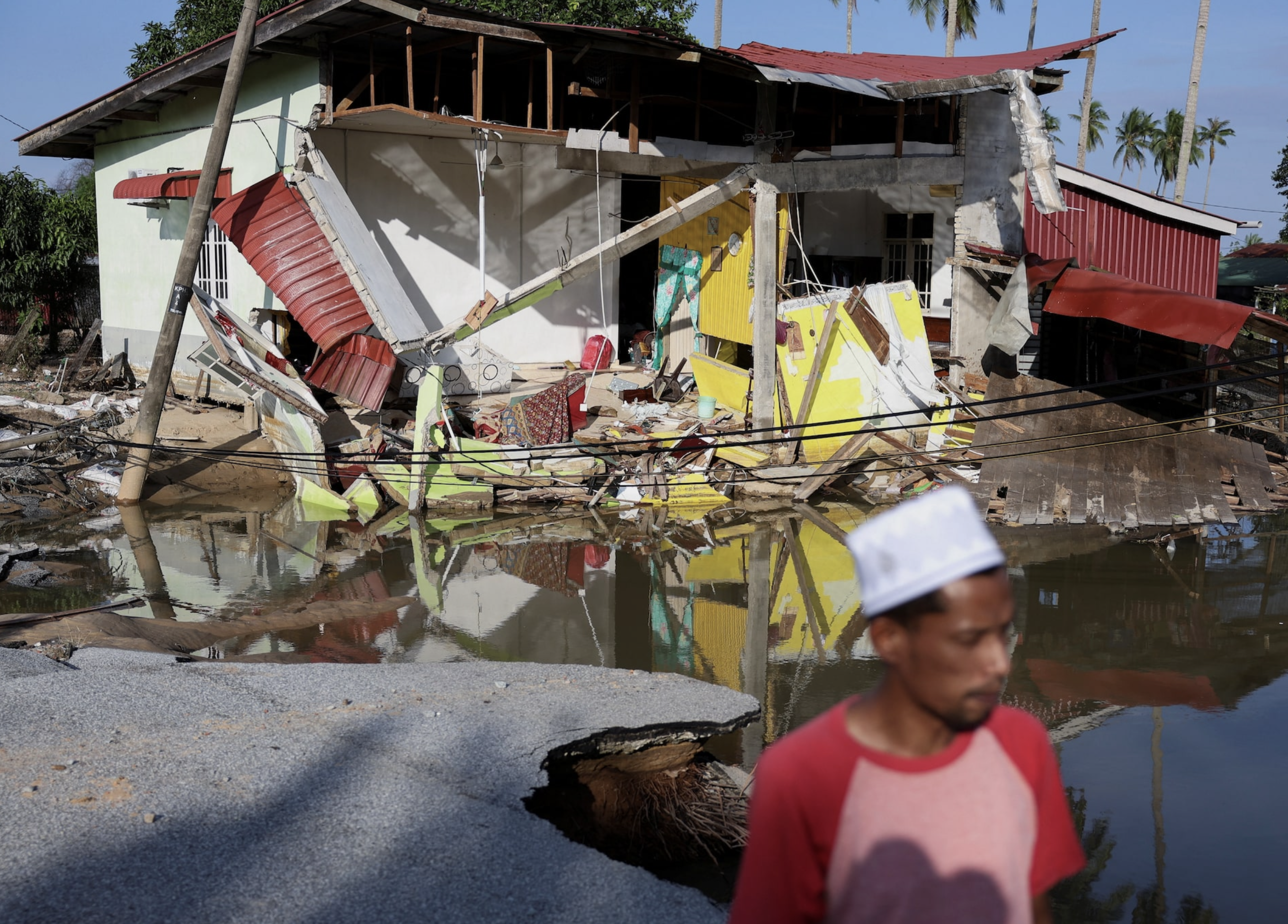 A view of a house partially destroyed after floodwaters swept through at Tumpat, Malaysia, December 2, 2024. Photo: Reuters