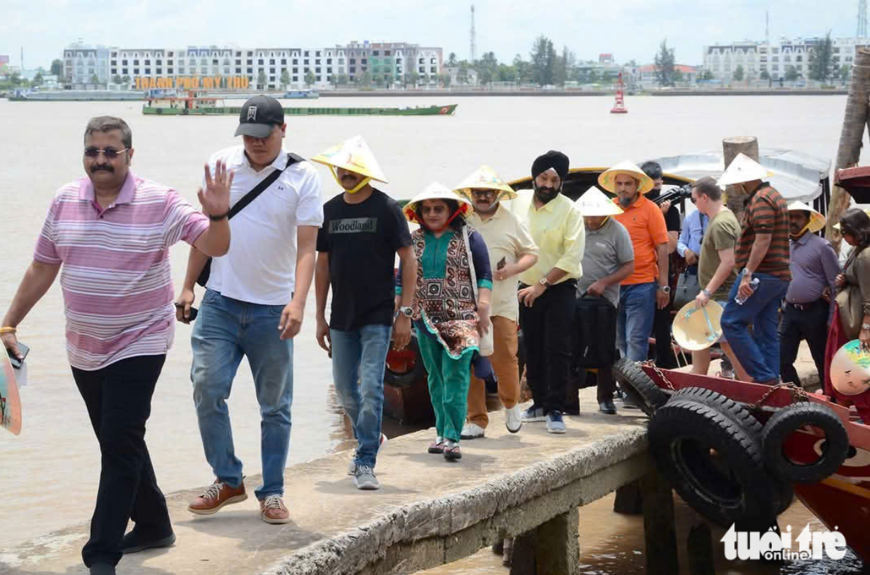 Tourists from India visit Thoi Son Islet, located downstream of the Tien River, a branch of the Mekong River in southern Vietnam. Photo: Hoai Thuong / Tuoi Tre