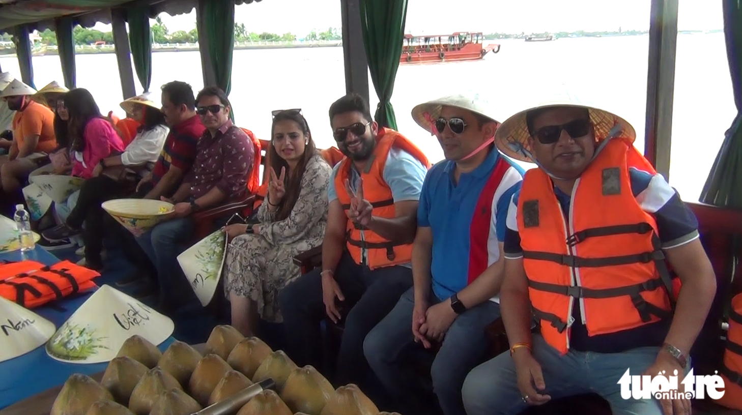 Tourists from India take a boat ride on the Tien River in the Mekong Delta region. Photo: Hoai Thuong / Tuoi Tre