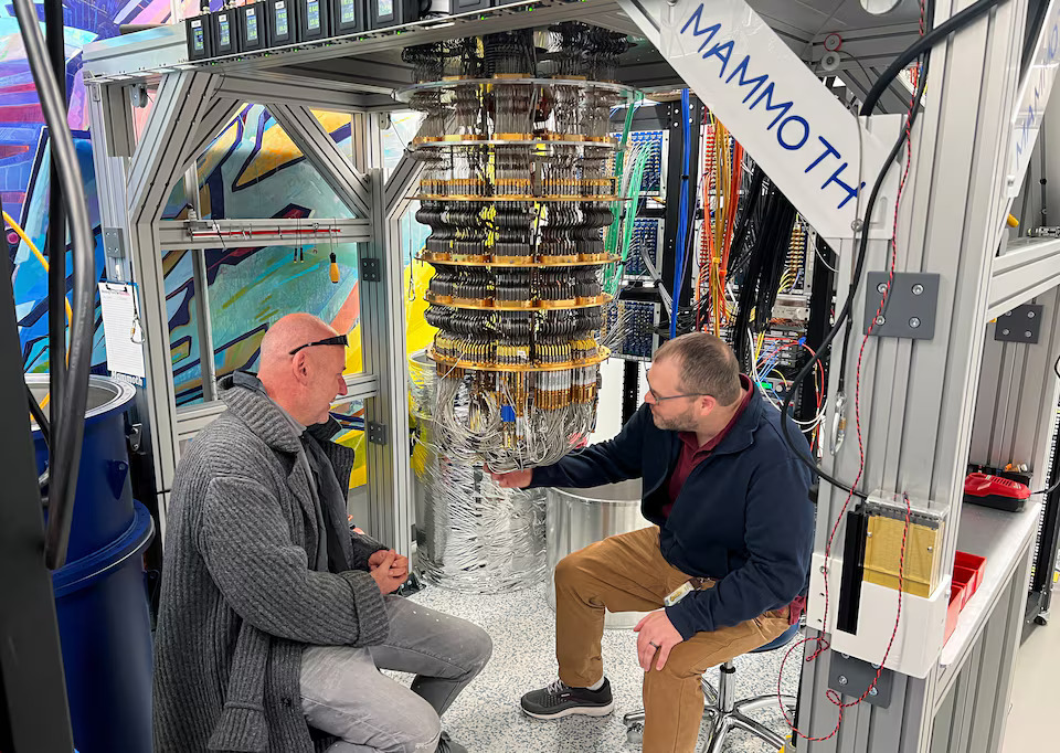 Google Quantum AI's Hartmut Neven (L) and Anthony Megrant (R) examine a cryostat refrigerator for cooling quantum computing chips at Google's Quantum AI lab in Santa Barbara, California, U.S. November 25, 2024. Photo: Reuters