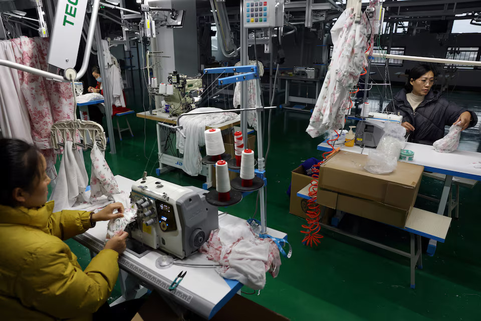 [6/10]Employees work on the production line of a lingerie factory at WeMet Industrial Park, in Guanyun county of Lianyungang, Jiangsu province, China November 25, 2024. Photo: Reuters