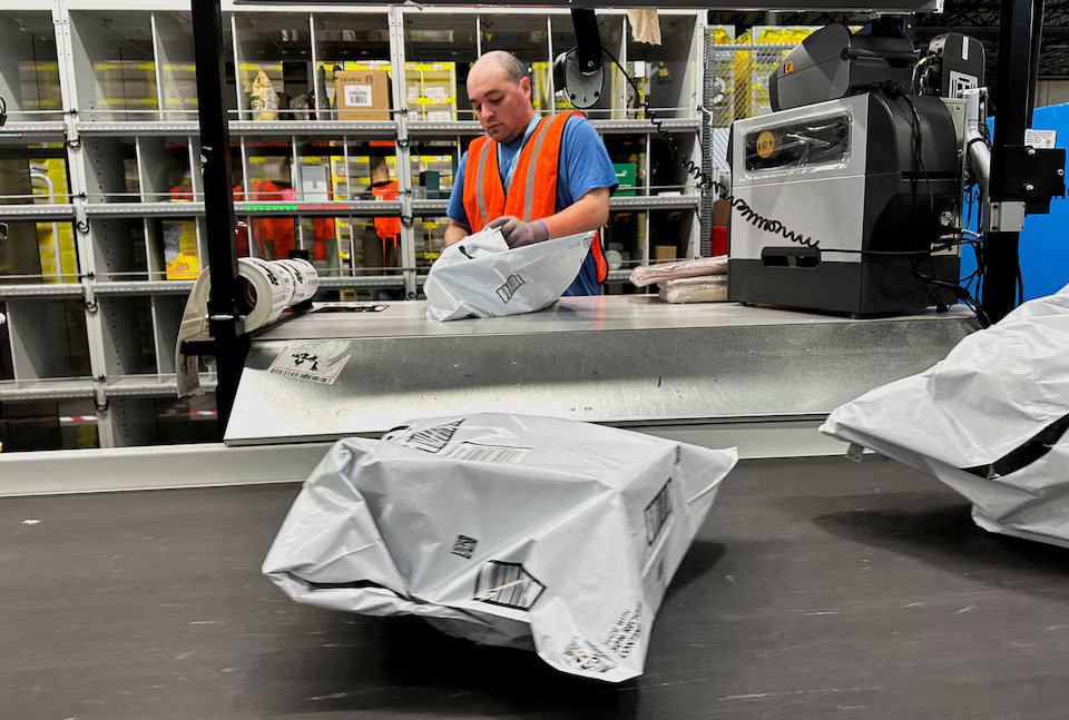 A person works at the Amazon warehouse, busy on Prime Day, in Melville, New York, U.S., July 11, 2023. Photo: Reuters