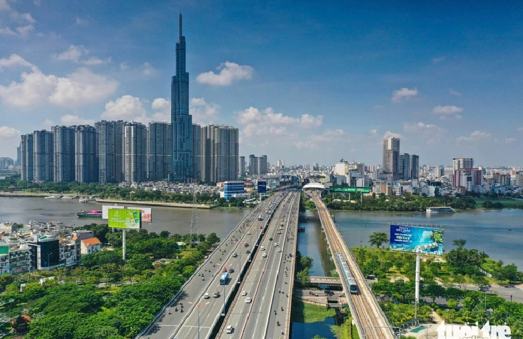 A train of the metro line No. 1 runs on an elevated section spanning the Saigon River in Ho Chi Minh City. Photo: Quang Dinh / Tuoi Tre