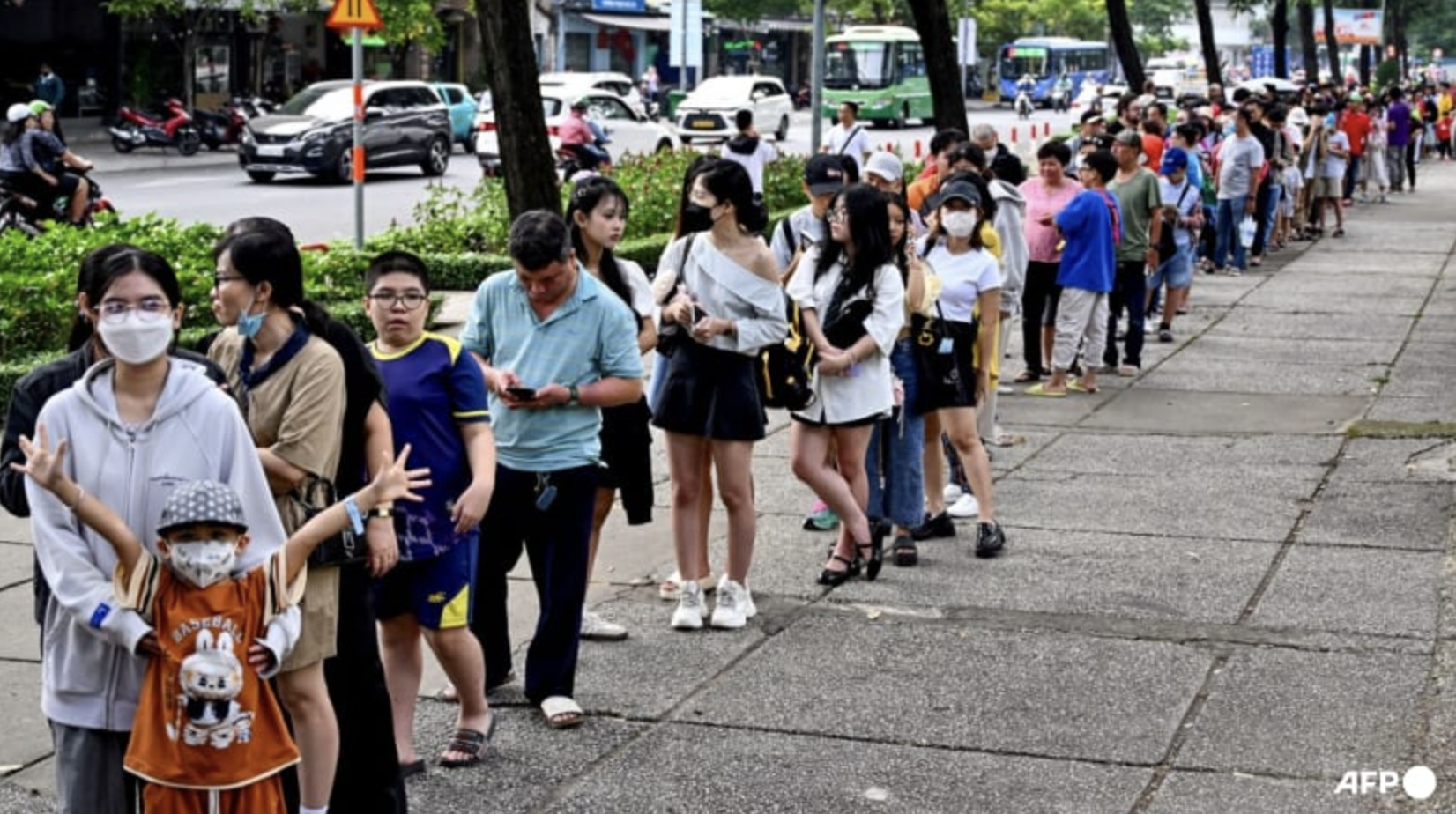 People line up as they arrive at a metro station in Ho Chi Minh City on Dec 22, 2024. Photo: AFP