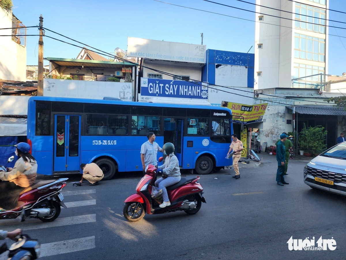 Traffic police officers examine the scene and investigate the cause of the accident in Ho Chi Minh City, December 23, 2024.