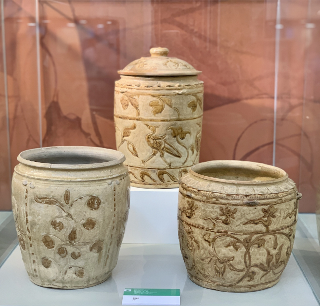 Ceramic containers portraying orchids on display at the History Museum of Ho Chi Minh City. Photo: Hoai Phuong / Tuoi Tre