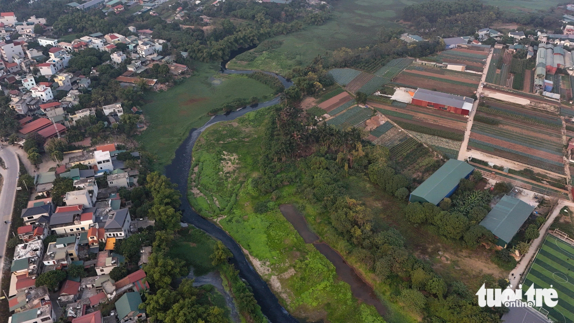 The Day River flows beneath Thang Long Boulevard in Yen Son Commune, Quoc Oai District in suburban Hanoi. Photo: Tuoi Tre