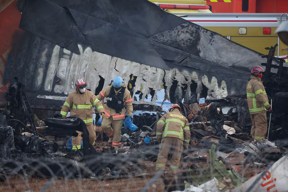 [5/11]Workers operate after an aircraft went off the runway and crashed at Muan International Airport, in Muan, South Korea, December 30, 2024. Photo: Reuters