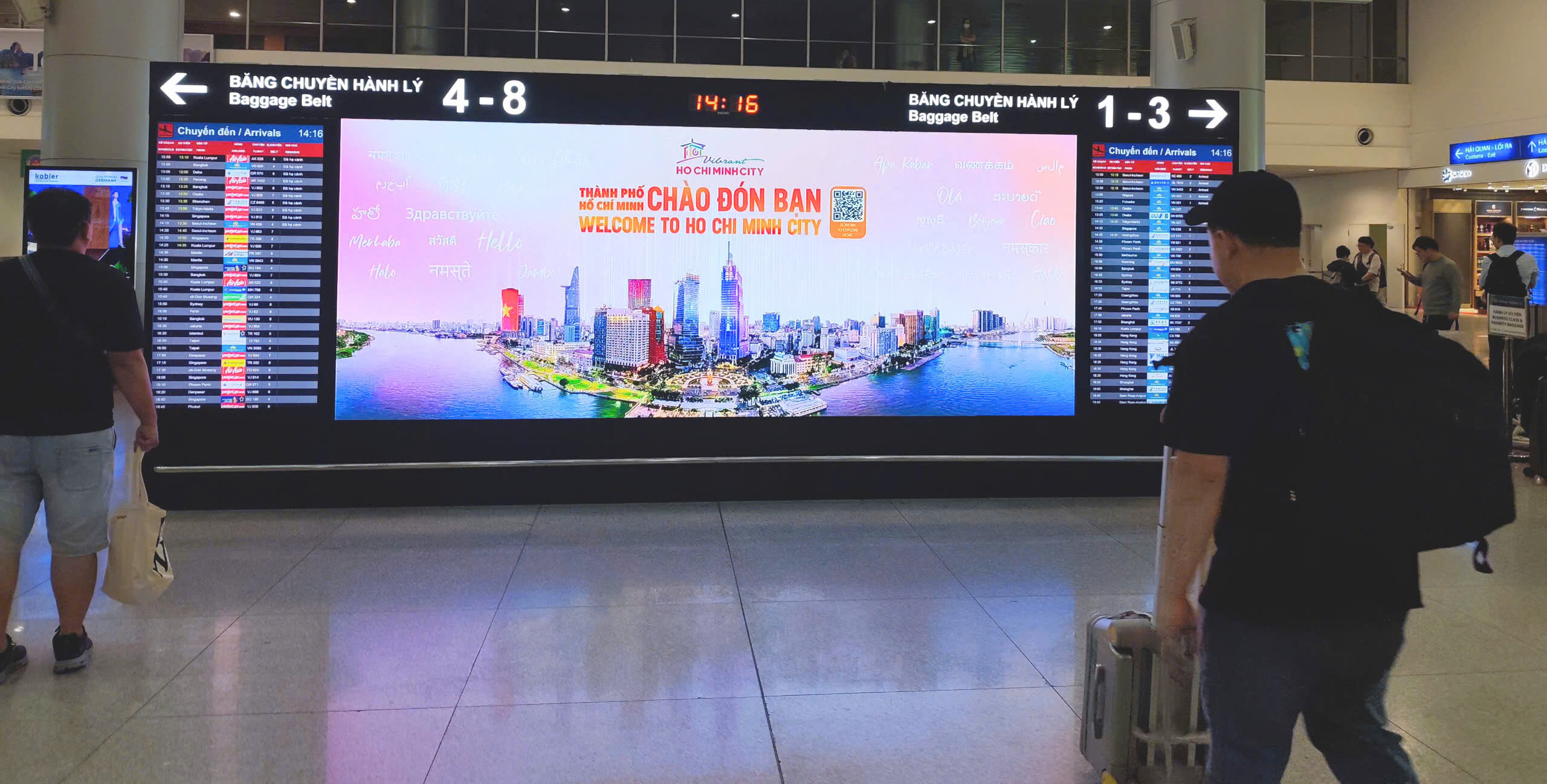 The ‘Welcome to Ho Chi Minh City’ message is presented in multiple languages and paired with QR codes linking to the city’s tourism information, reflecting its hospitality toward visitors.