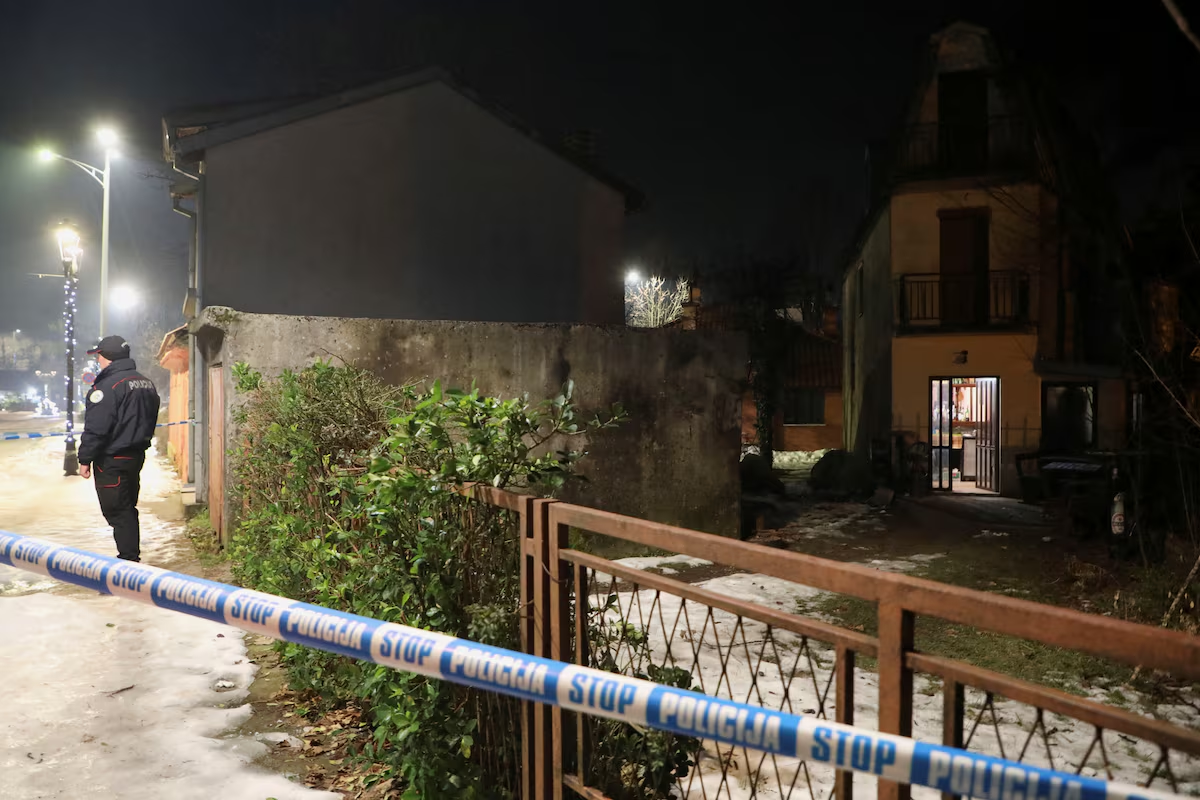 A police officer stands guard in front of a restaurant where a gunman opened fire and killed several people in Cetinje, Montenegro, January 1, 2025. Photo: Reuters