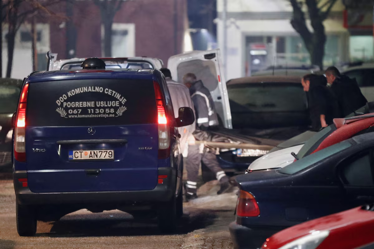 Workers carry a body after a gunman opened fire and killed several people in a restaurant in Cetinje, Montenegro, January 1, 2025. Photo: Reuters