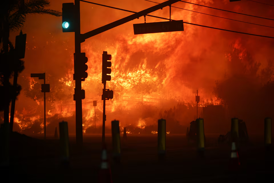 Wildfire rages in Los Angeles, forcing 30,000 to evacuate