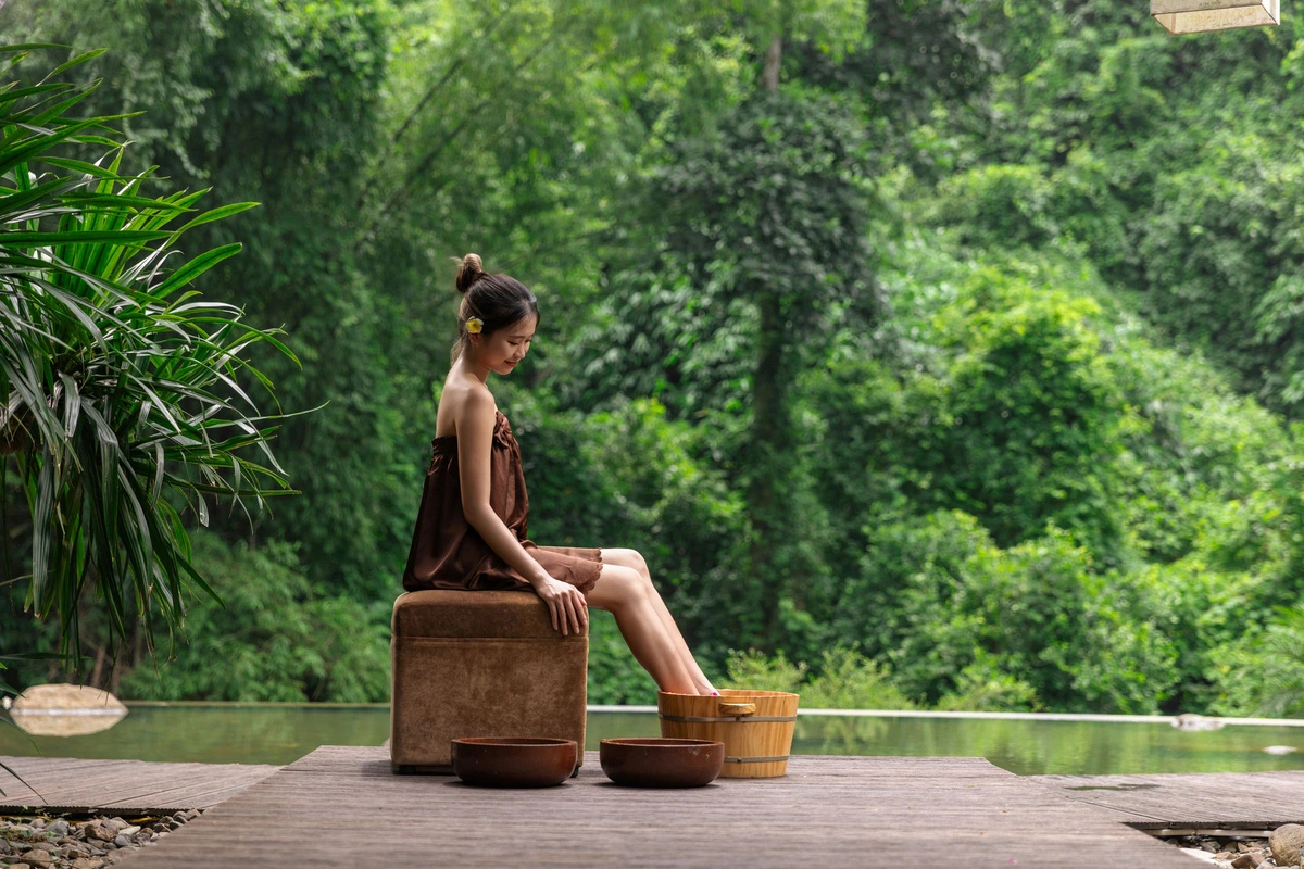 A woman experiences mineral water from Kim Boi hot spring in Hoa Binh Province, northern Vietnam. Photo: SG