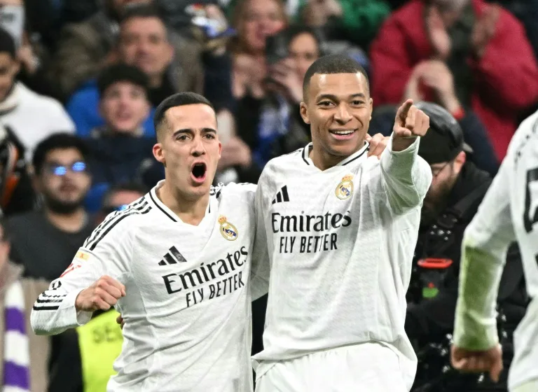 Real Madrid's French forward #09 Kylian Mbappe (R) celebrates scoring his team's third goal with Real Madrid's Spanish defender #17 Lucas Vazquez during Spanish league football match between Real Madrid CF and UD Las Palmas at the Santiago Bernabeu stadium in Madrid on January 19, 2025. Photo: AFP