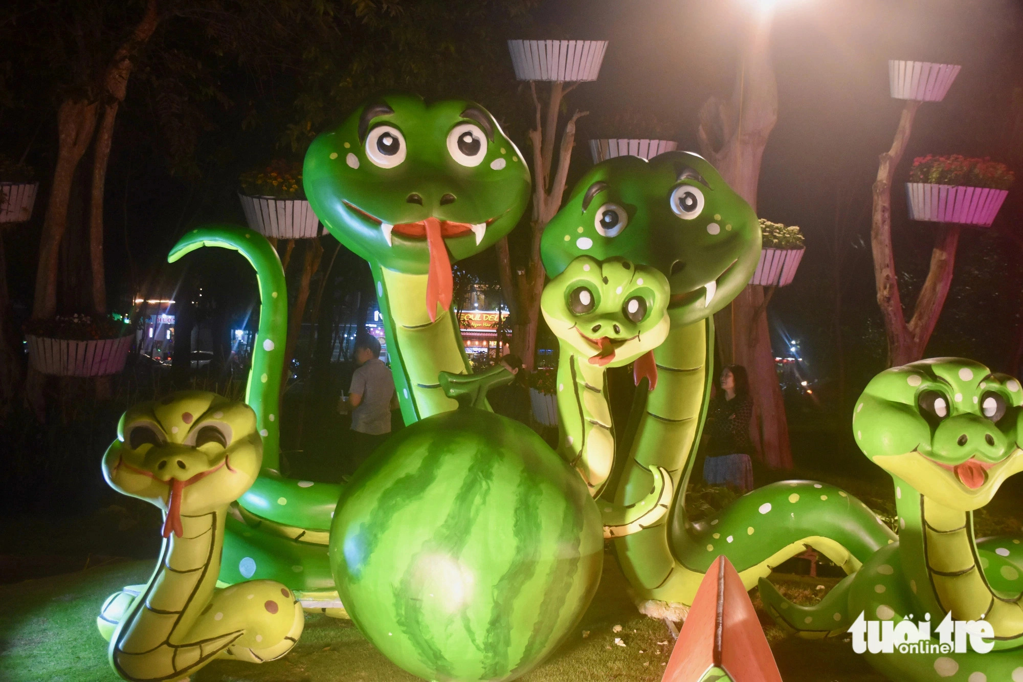 A display features snake and watermelon mascots. Photo: Minh Chien / Tuoi Tre