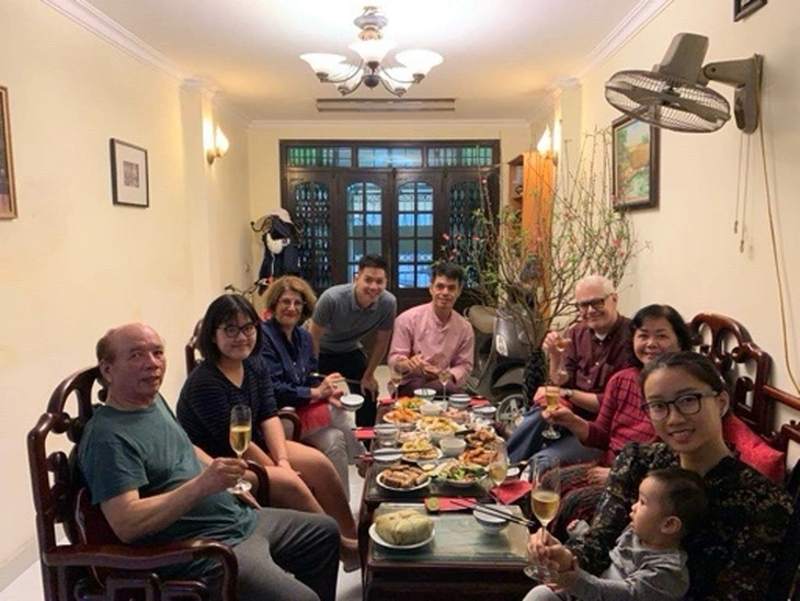 Chris Jeffery (wearing a plum-red shirt and glasses), pro-vice chancellor of the British University Vietnam, is seen with his relatives and friends at a Vietnamese Lunar New Year (Tet) party in Hanoi, Vietnam. Photo: Supplied