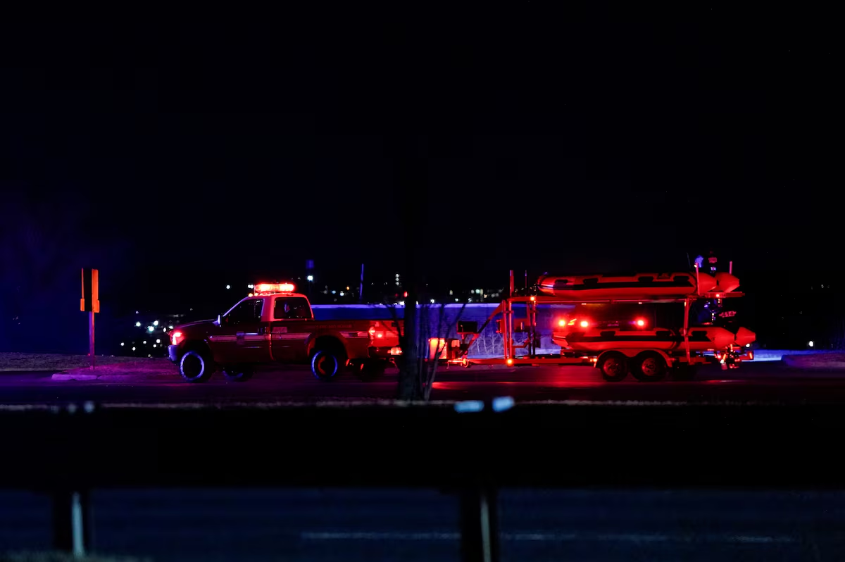 Emergency vehicles leave Gravelly Point, after American Eagle flight 5342 collided with a helicopter while approaching Reagan Washington National Airport and crashed in the Potomac River, in Arlington, Virginia, U.S. January 29, 2025. Photo: Reuters