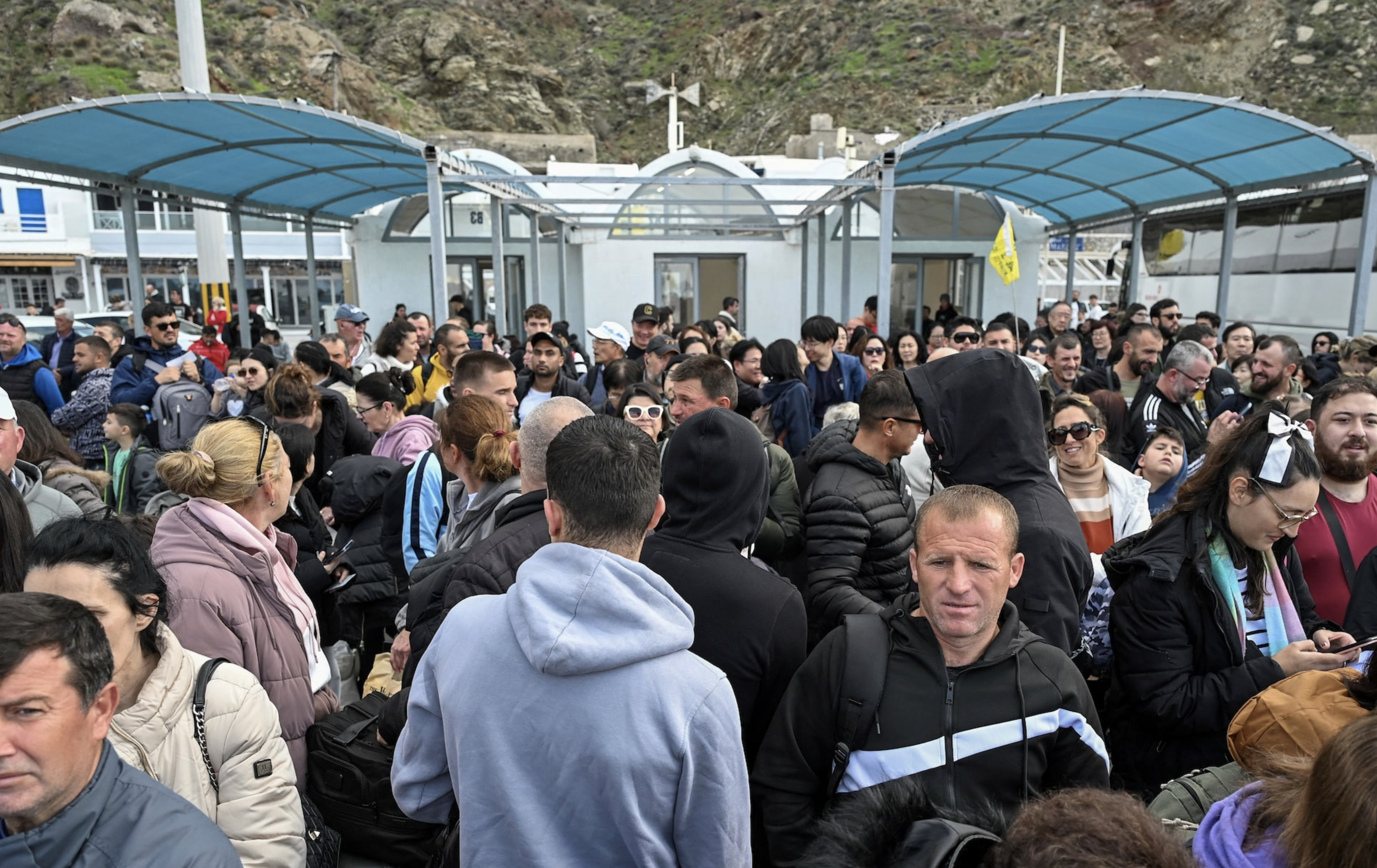 Passengers wait to board a ferry as they leave following high seismic activity on the island of Santorini, Greece, February 3, 2025. Photo: Reuters