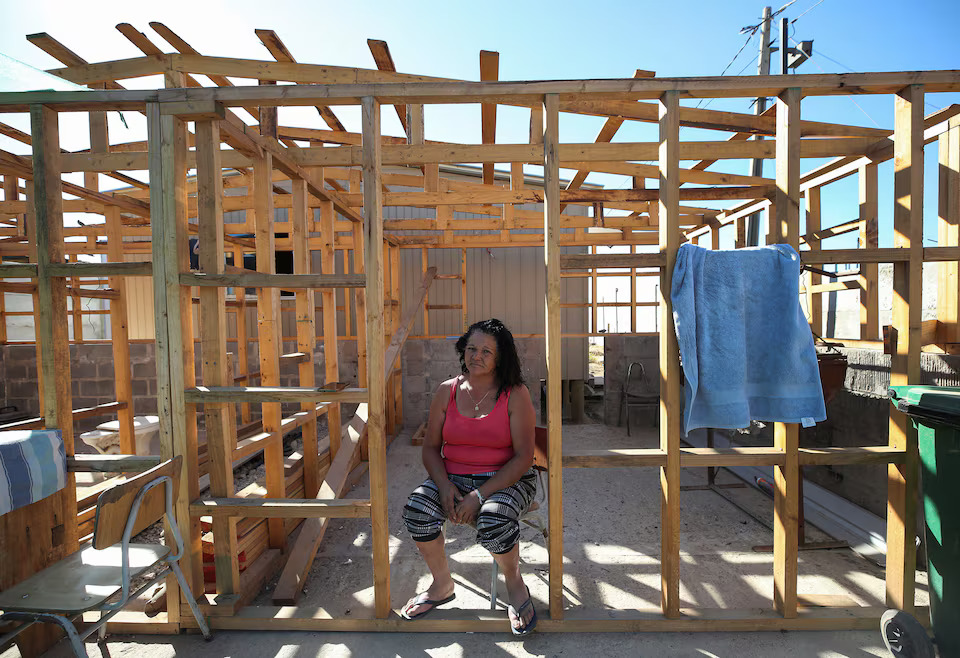 [3/6]Lucia Ramirez, 61, poses for a picture at the site of her house which is being rebuilt after it was destroyed by wildfires, in the neighborhood of Pompeya Sur in Quilpue, Chile January 31, 2025. Photo: Reuters