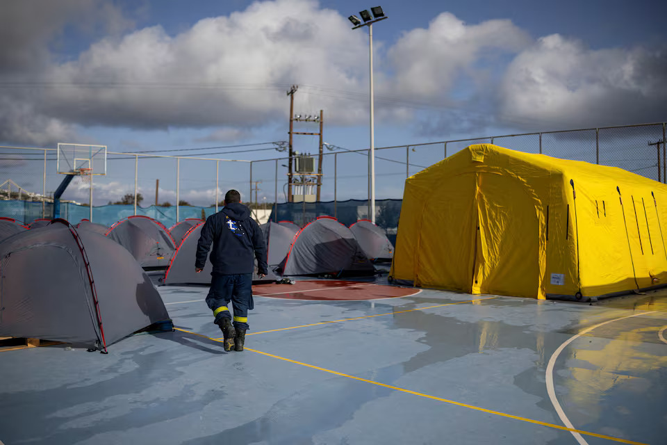 [9/20]A firefighter walks next to tents used by emergency crews during increased seismic activity on the island of Santorini, February 4. Photo: Reuters